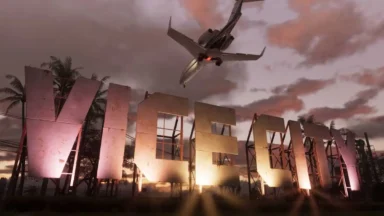 Airplane flying over illuminated Vice City sign at sunset