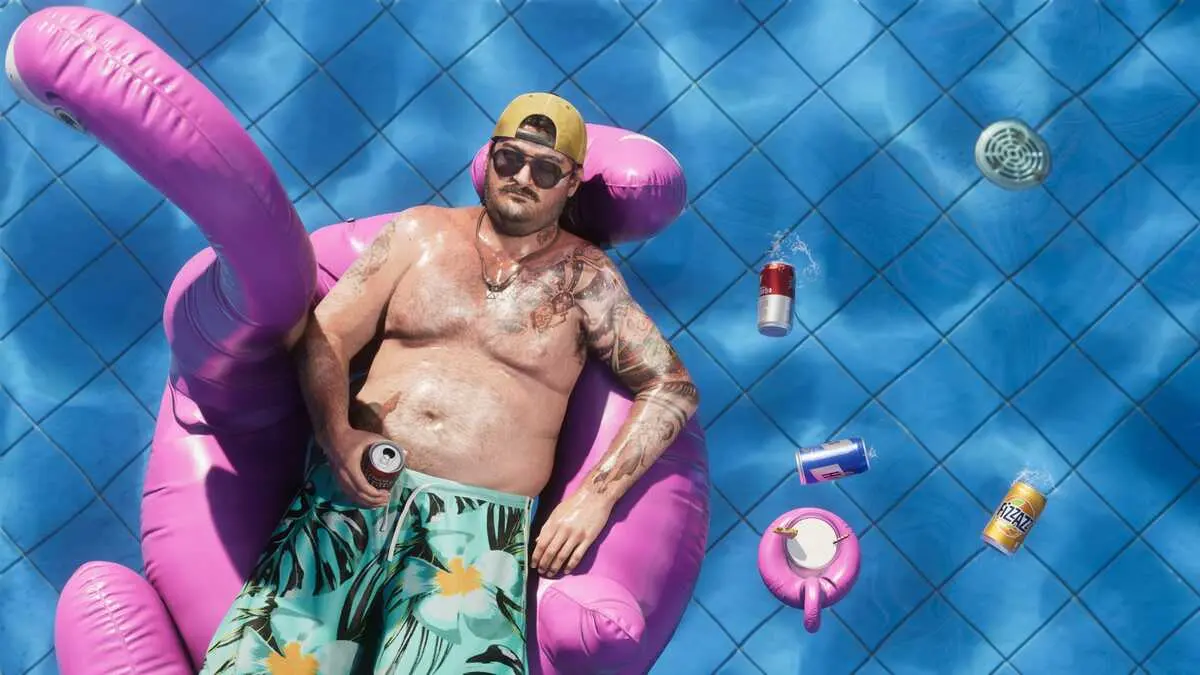 Man lounging on pink flamingo float in pool