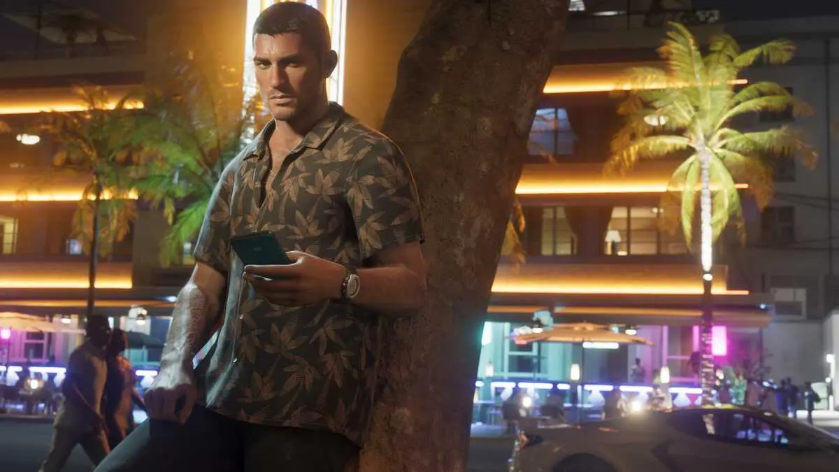Man with smartphone under neon city lights