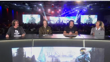 Panel discusses Halo event on stage with audience