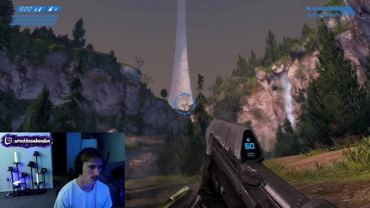 Halo gameplay overlooking forested canyon and waterfall