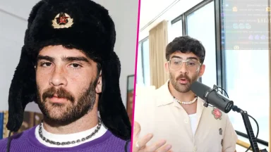 Two men, one with a hat, another speaking into mic