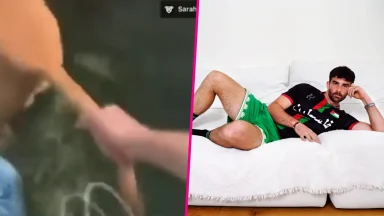 Man relaxing on couch and person touching dog.