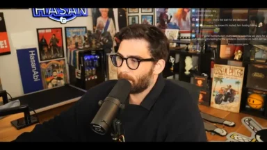 Person broadcasting in a decorated streaming room.