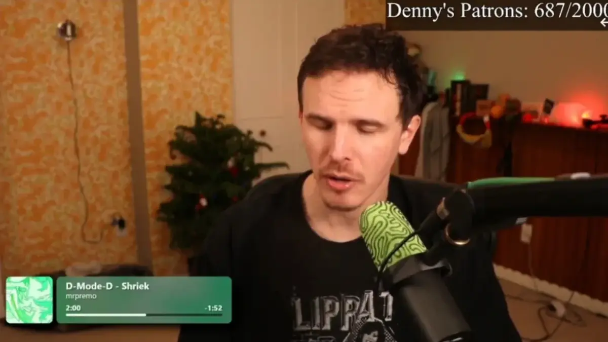 Man streaming with green microphone and background decor