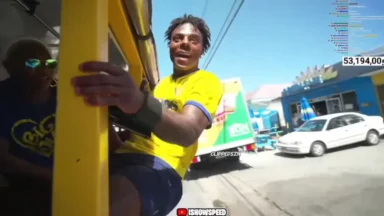 Man leaning from yellow vehicle on sunny street