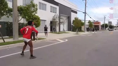 Person in Ronaldo jersey running on street.