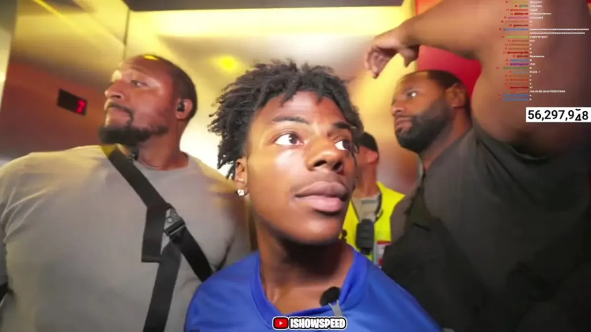 Young man with security in crowded elevator