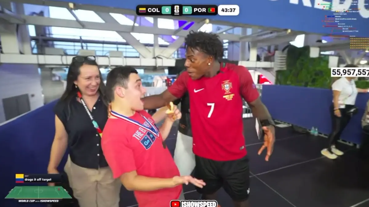 Man in Portugal jersey greeting excited fan