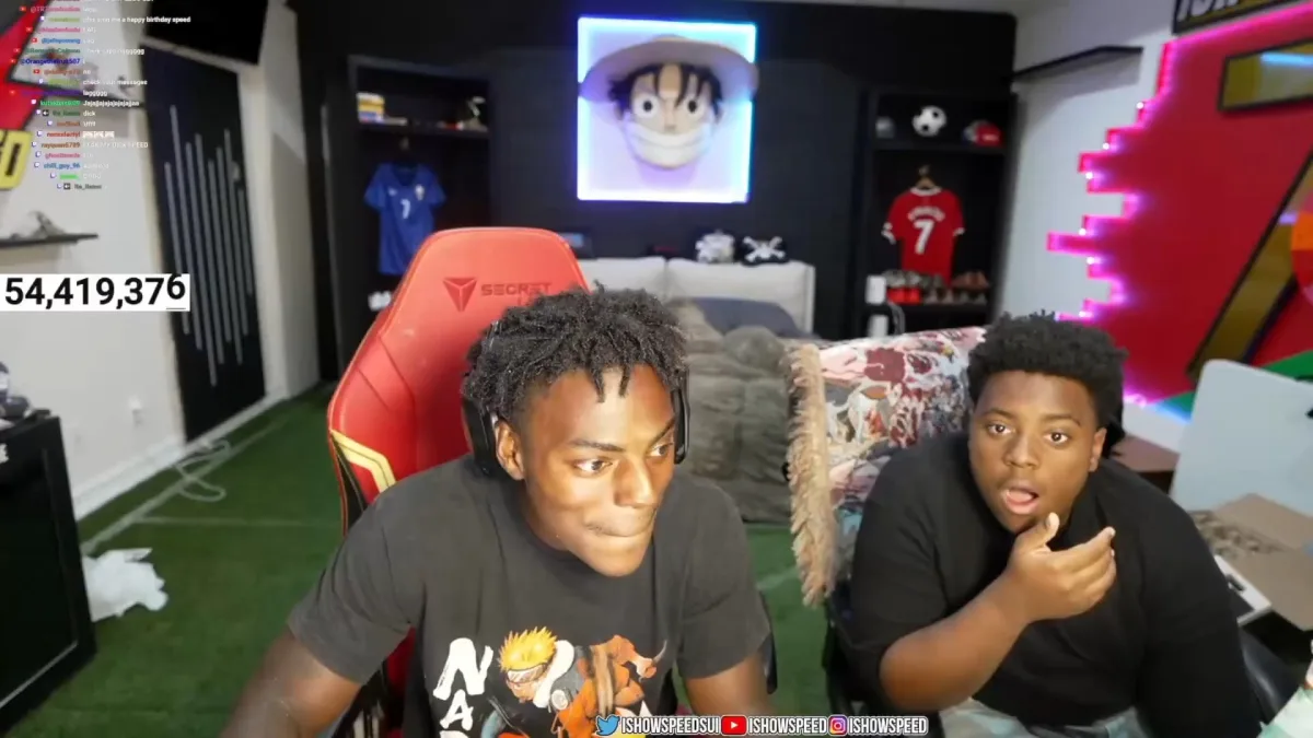 Two young men livestreaming in gaming room setup