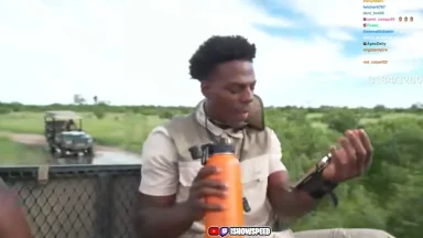 Person holding orange bottle during safari trip