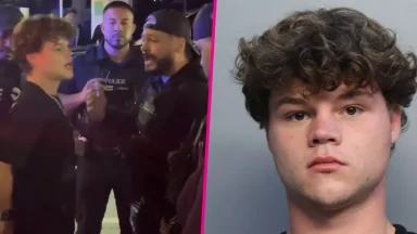 Police officers detain young man at night scene