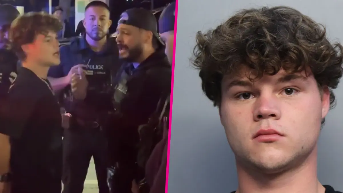 Police officers detain young man at night scene