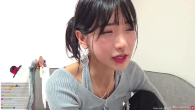 Person streaming online, chatting with viewers.