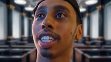 Close-up of man speaking in modern lecture hall