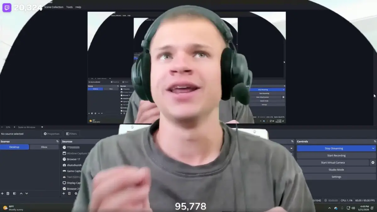 Man wearing headset streaming on computer setup