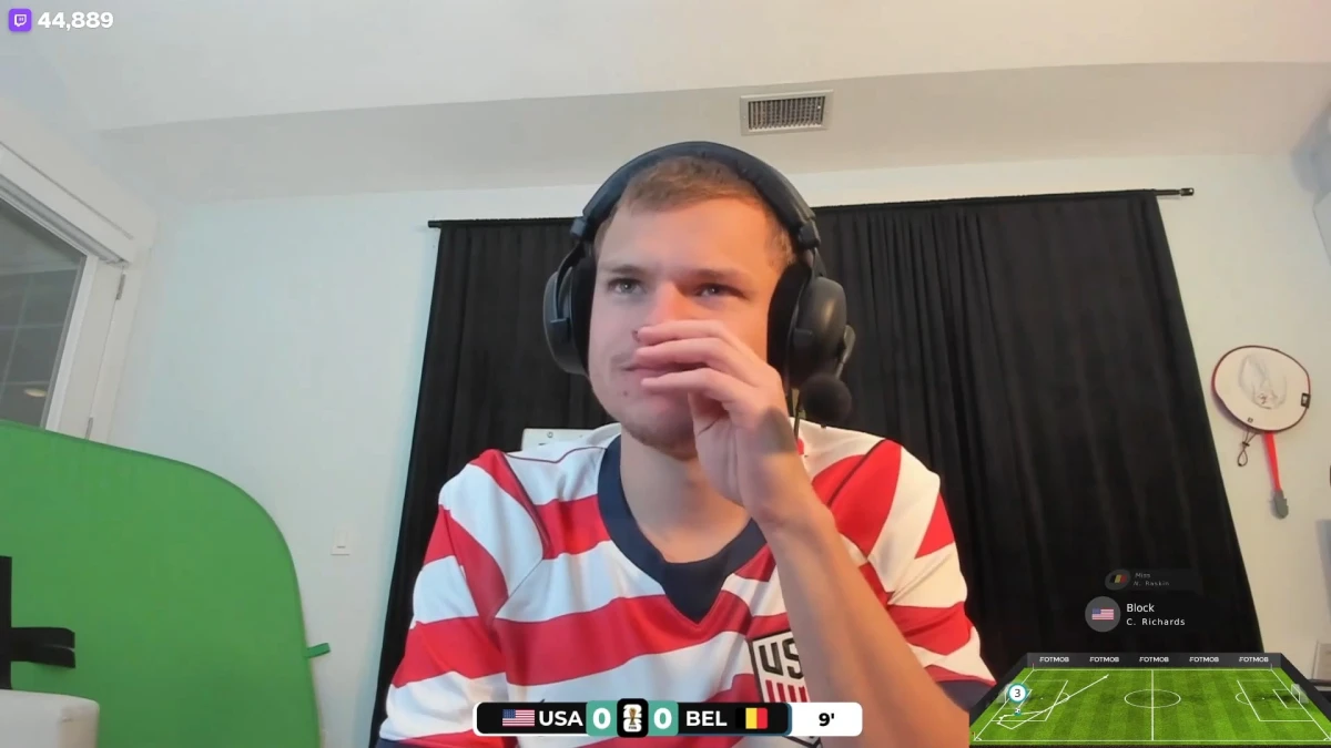 Man in USA jersey watching soccer match livestream