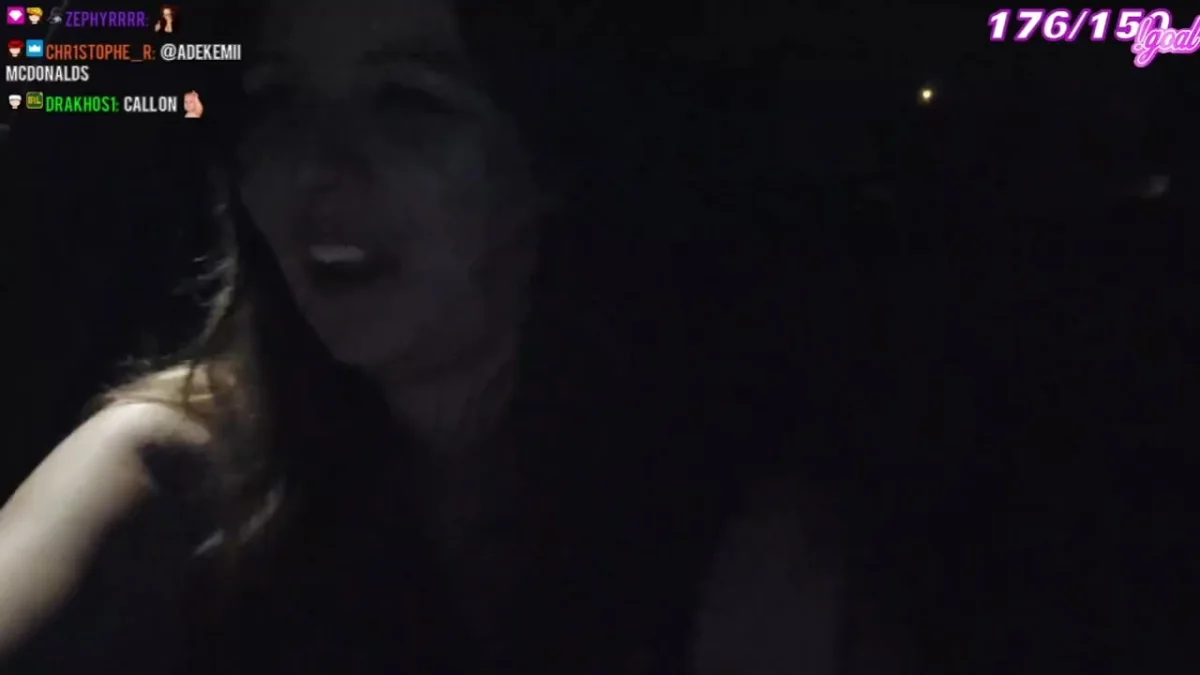 Woman streaming at night in low light