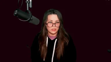 Person speaking into microphone during podcast recording