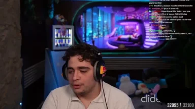 Streamer wearing headset in colorful gaming room