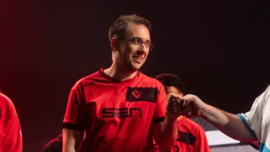 Esports player in red jersey fist-bumping opponent