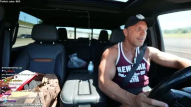 Man livestreaming while driving a pickup truck