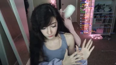 Person streaming in a cozy room setup.