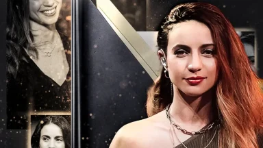 Woman posing at glamorous event with artistic background