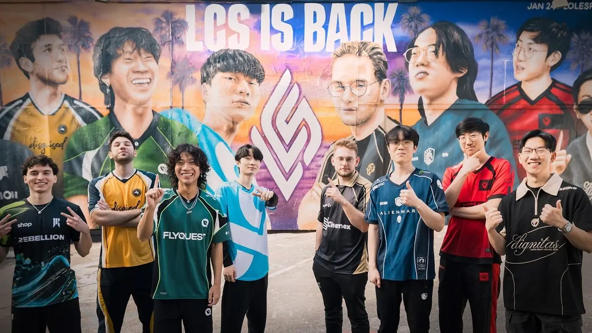 Esports players posing in front of LCS mural