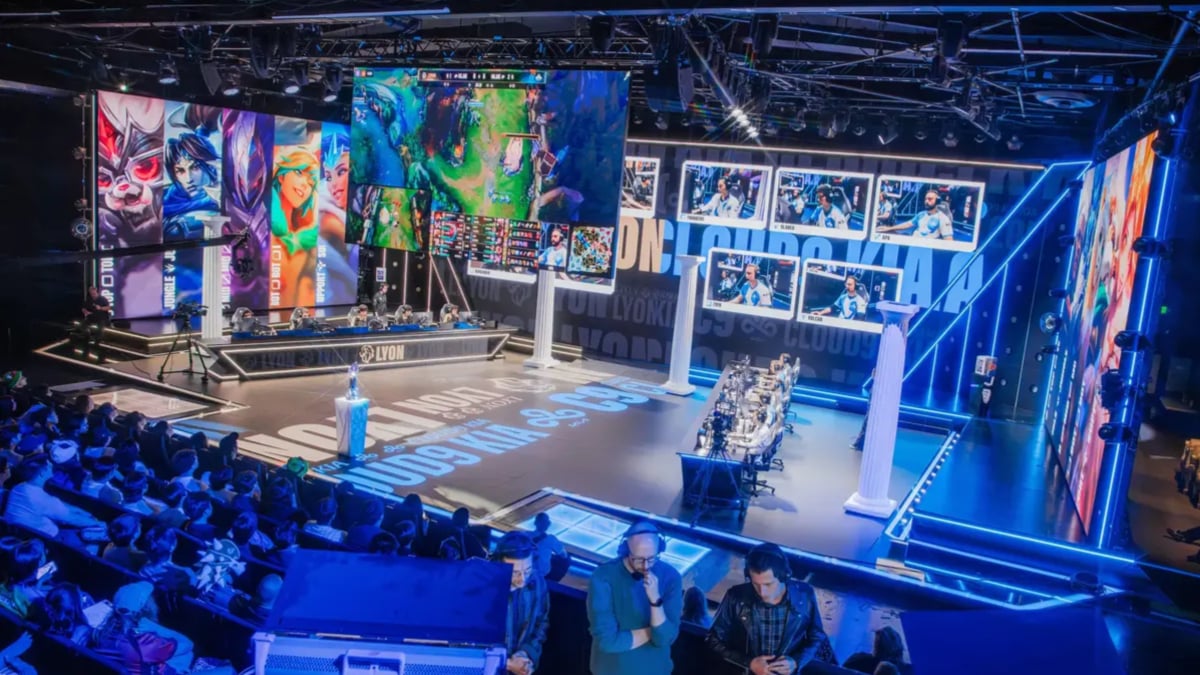 League of Legends esports stage with players and audience
