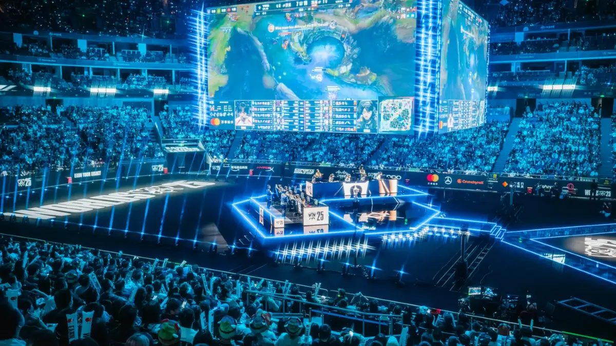 Crowd watches esports match on massive arena screens