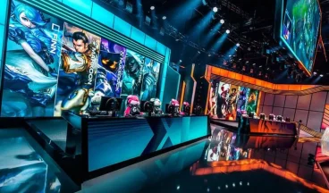 Esports stage with large screens and team setups