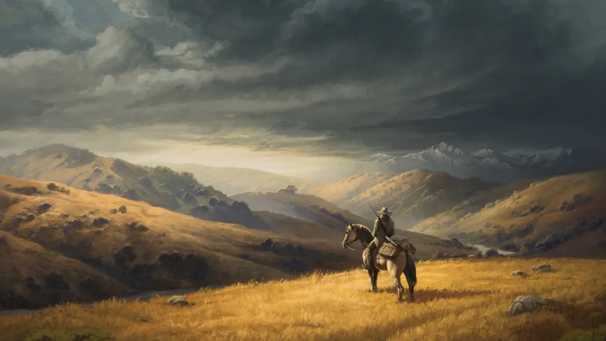 Lone rider overlooking golden hills and mountains