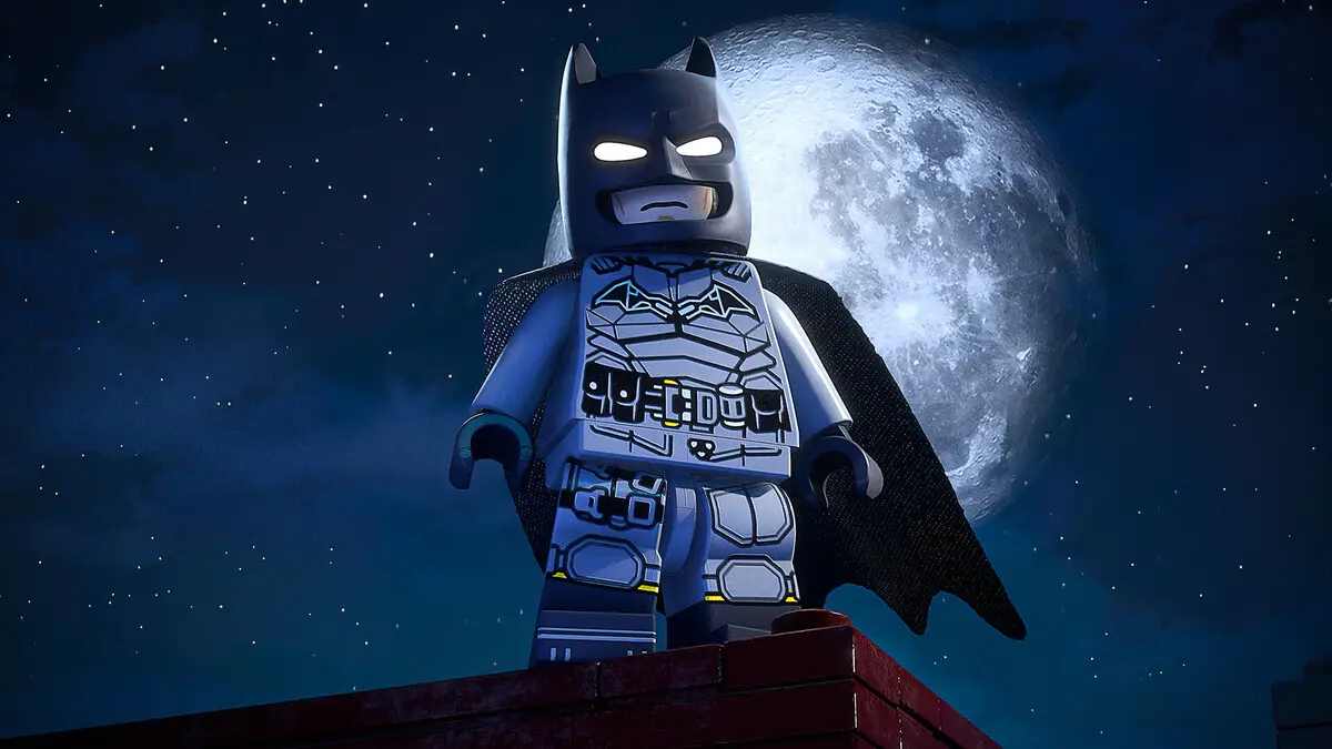 LEGO Batman figure on rooftop under full moon