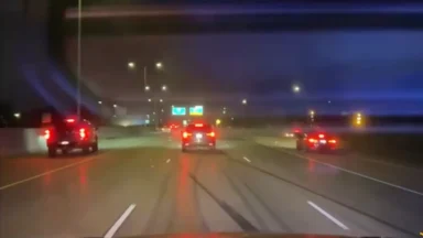 Cars driving on highway at night