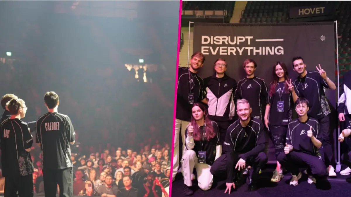 Team on stage at gaming event, group photo.
