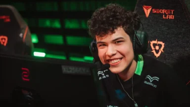 Smiling esports player wearing headset at gaming competition