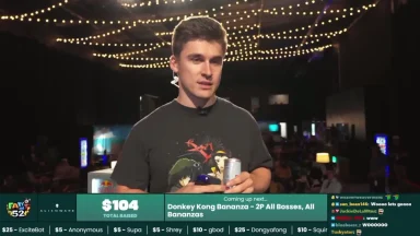 Man speaking at gaming charity event stage