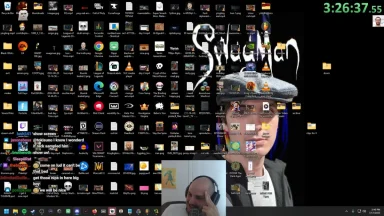 Crowded desktop with many icons and streamer overlay.