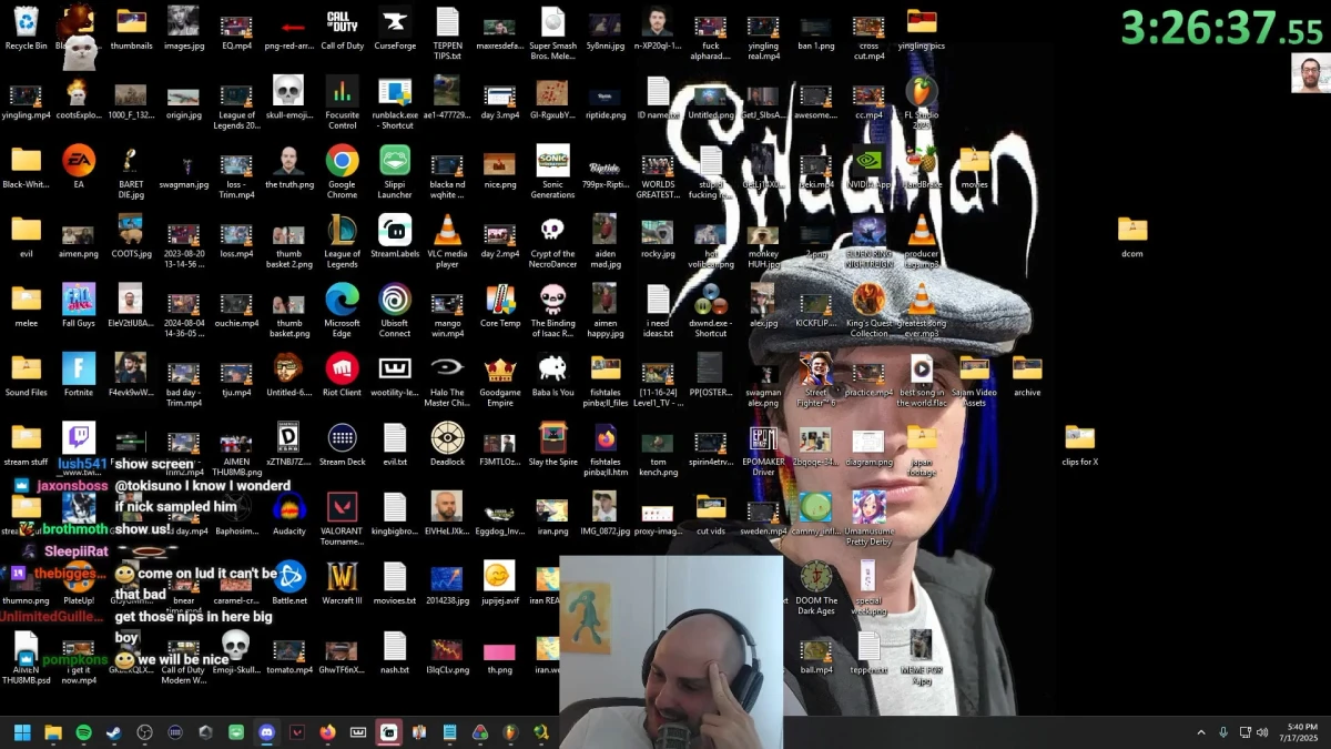 Crowded desktop with many icons and streamer overlay.