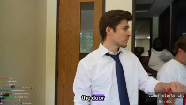 Man in tie opening classroom door indoors