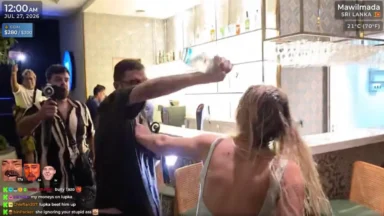 Man throws drink at woman in bar