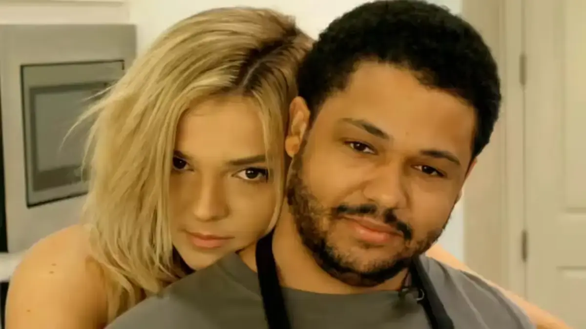 Couple posing closely together in a kitchen