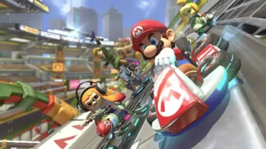 Mario and racers speeding along a tilted futuristic track