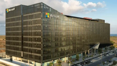 Modern office building with Microsoft logo.