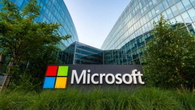 Microsoft sign outside modern glass office building