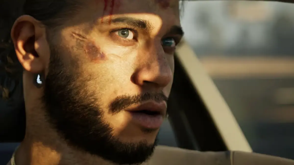 Man with facial bruises driving a car