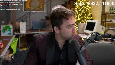 Person streaming with holiday decorations in background.