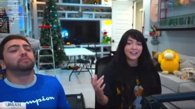 Two people streaming in a decorated room