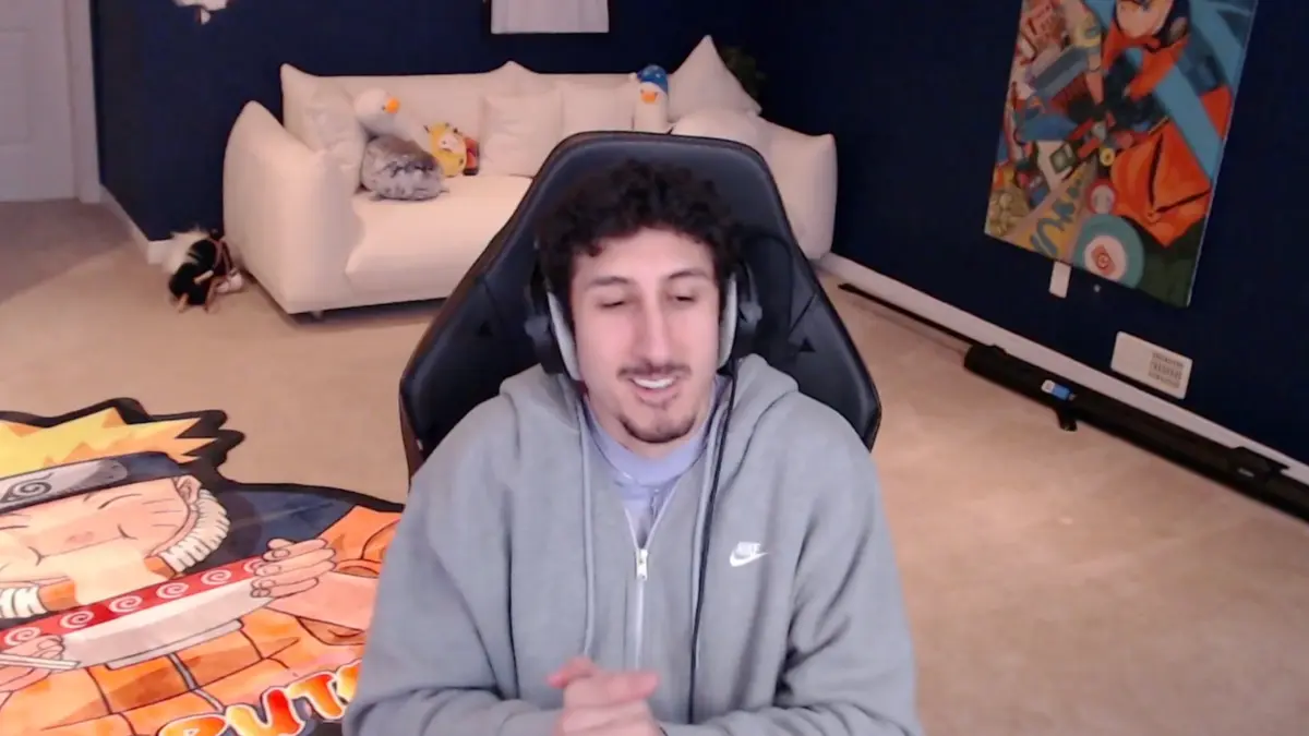 Man streaming in gaming room with anime decor